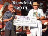 Lemoore Senior Center President Richard Rea receives a check from Lemoore Lions President Greg Martella.